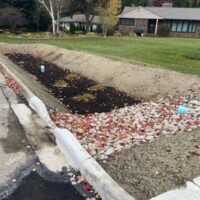 An SWPPP bioretention cell drains roadway water and filters pollutants