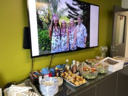 With photos of Mike Trump and his family displayed on a large screen overhead, EnviroScience employees filled a table of tasty foods to complement the chili-tasting ceremony.