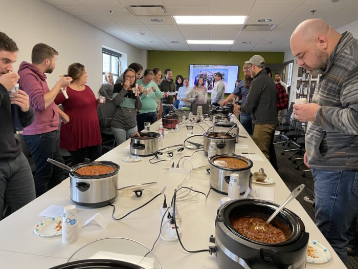EnviroScience employees line up for a taste at the 2022 Mike Trump Chili Cookoff.