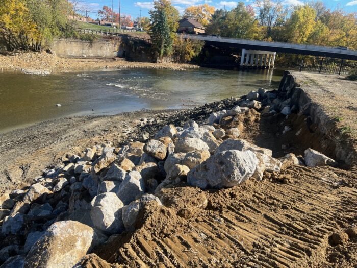 Rock and soil stabilization along the Mahoning River near the Summit Street Bridge in Warren, Ohio, during dam removal and river restoration.